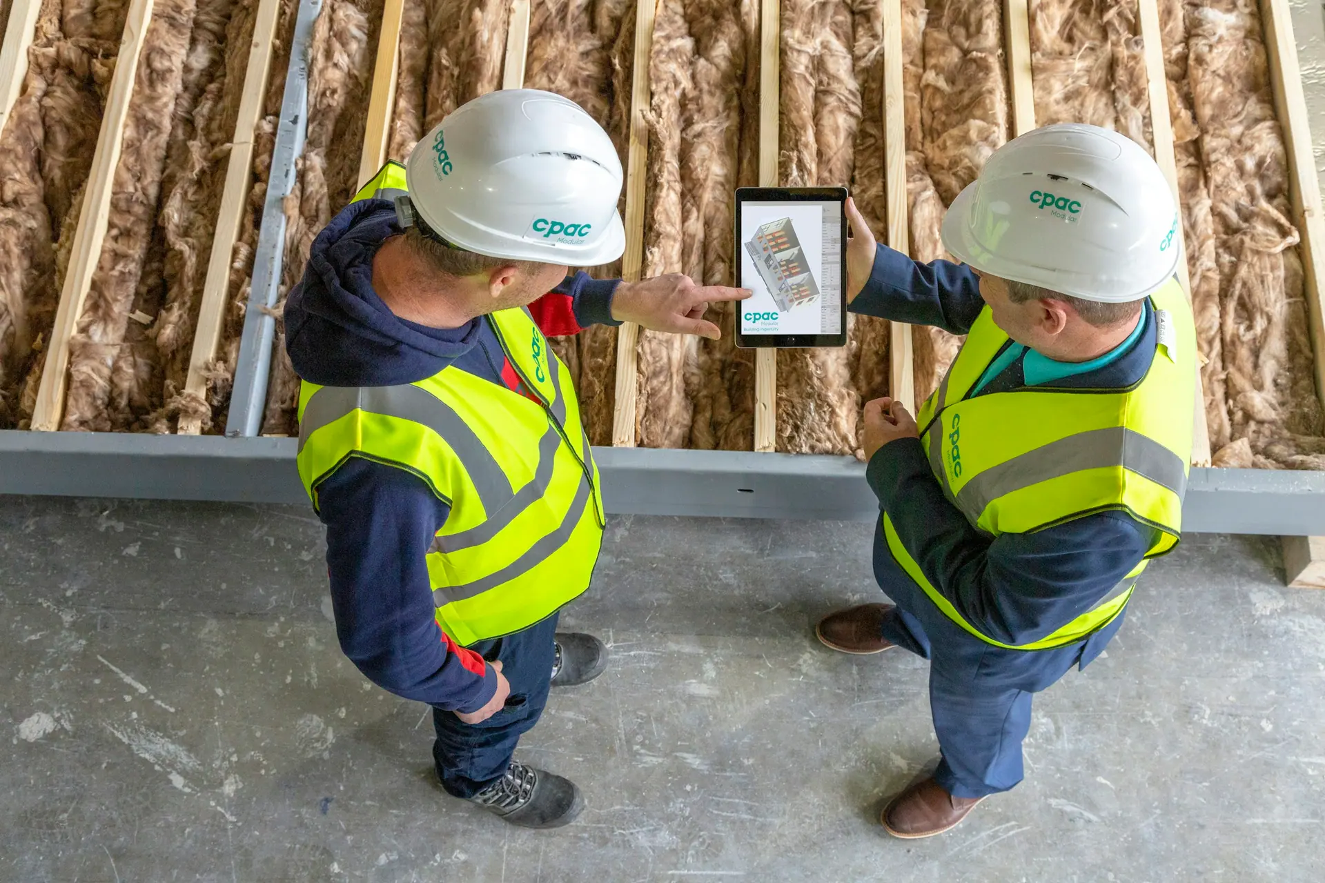 Supervisor reviewing information on a tablet on site