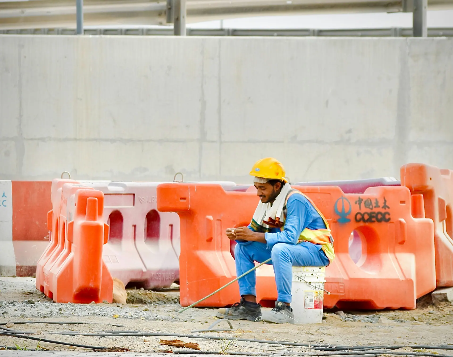 Construction worker using a phone on site