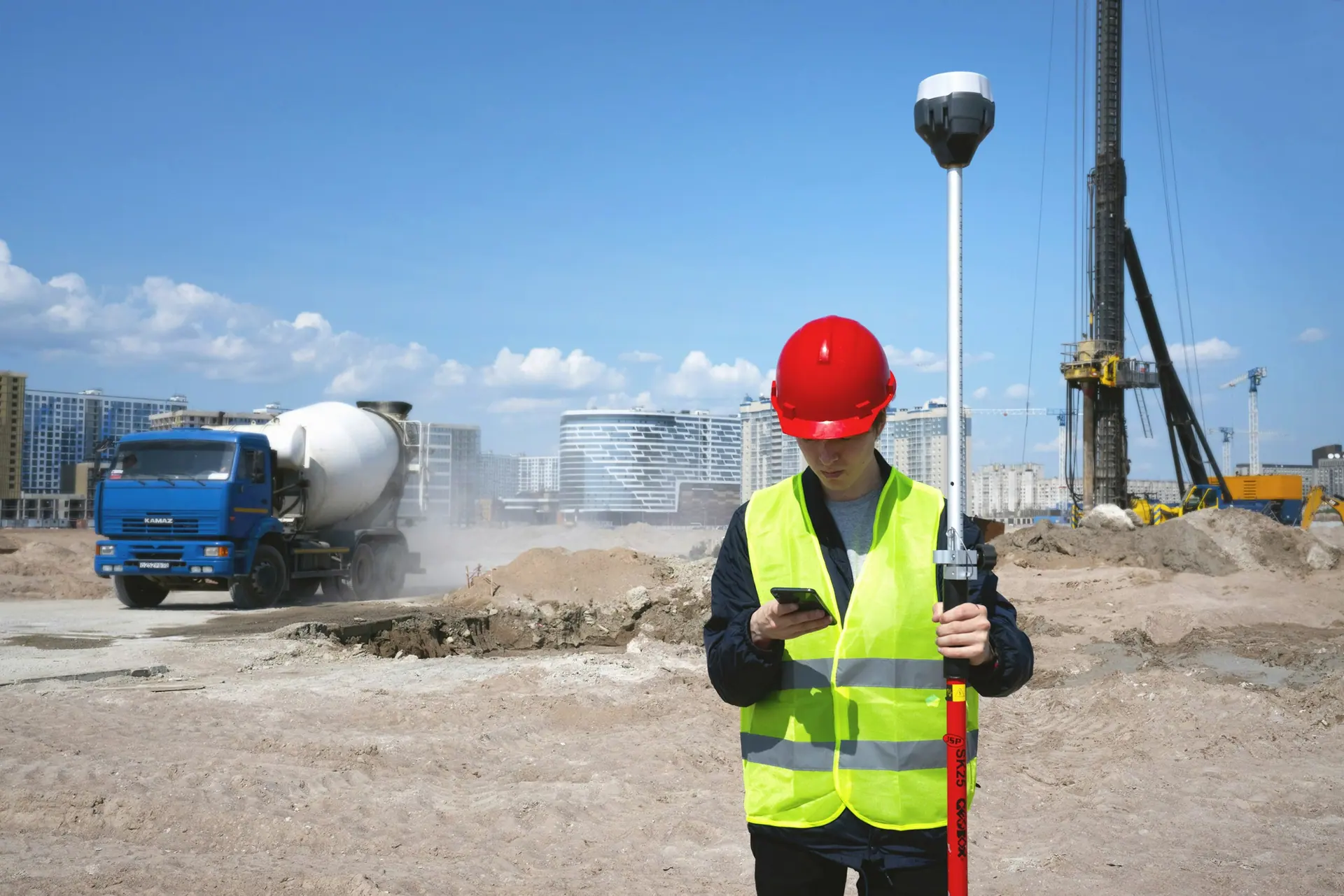 Construction worker using a tablet on a building site