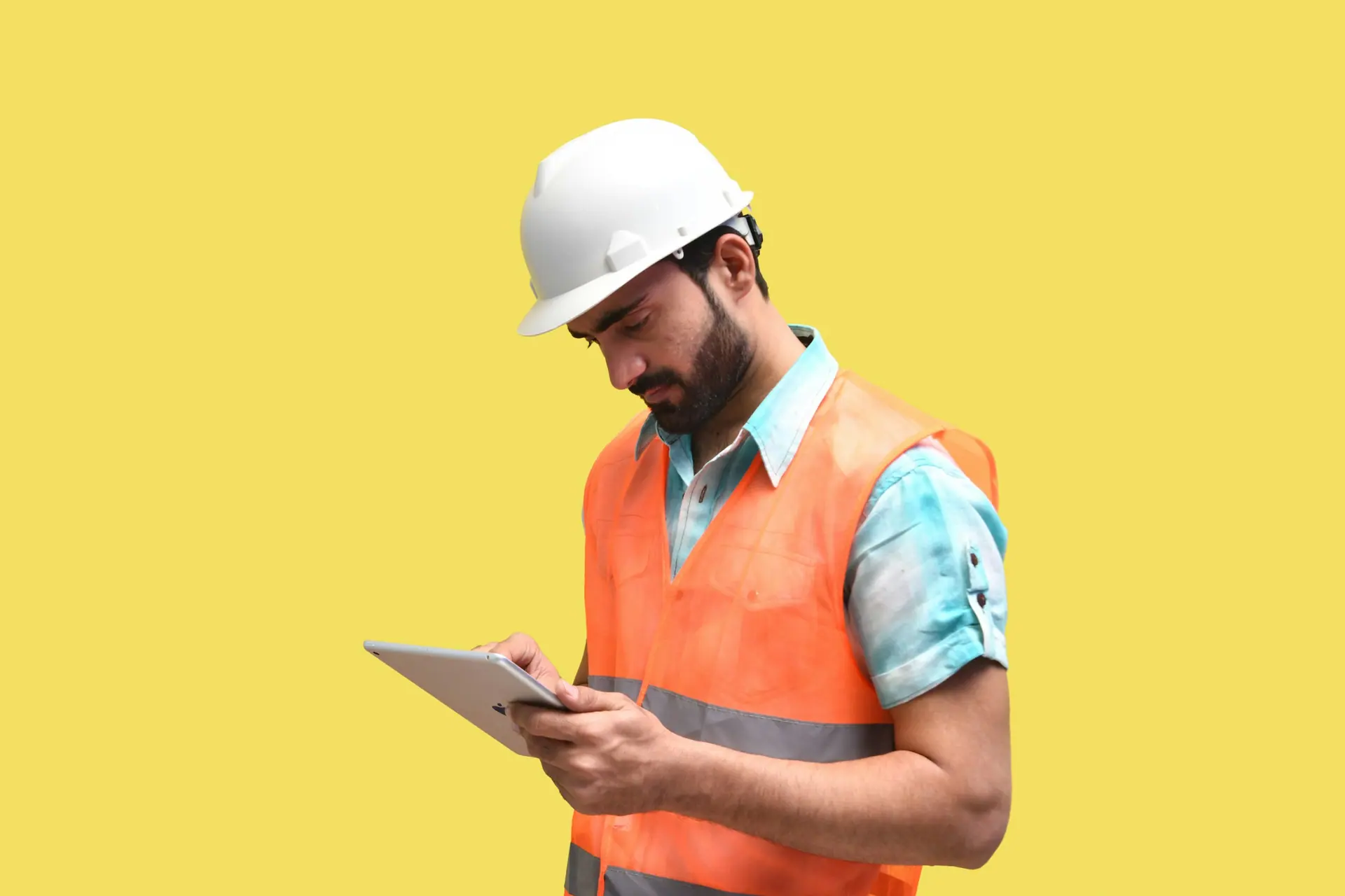 Construction supervisor using a tablet on site